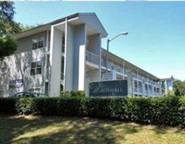 Whitehall Apartments building and entrance sign