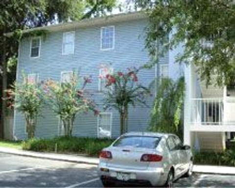 Building exterior with flowering shrubs
